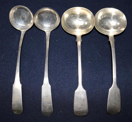 A pair of George III Scottish silver fiddle pattern sauce ladles and one other pair